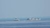 菲律賓海岸防衛隊2023年9月24日發布的拍攝於9月20日的照片顯示，中國海警船在南中國海斯卡伯勒淺灘附近的浮標屏障旁。
