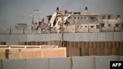 Uharibifu wa majengo katika Eneo lililoko mpakani kati ya Misri na Ukanda wa Gaza , Julai 4 2924. Picha na Giuseppe CACACE / AFP.
