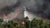 Greek residents flee as wildfire rages uncontrolled near Athens