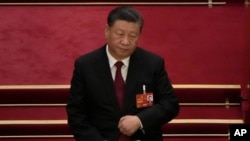 2023 年 3 月 5 日，中国国家主席习近平出席在北京人民大会堂举行的全国人民代表大会开幕式。（美联社照片/Ng Hanguan）