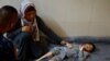 Mama wa Kipalestina Ghaneyma Joma akiwa na mtoto wake Younis Joma ambaye afya yake imeendelea kuwa mbaya kutokana na vita, katika hospitali ya Nasser, huko Khan Younis, upande wa kusini wa Ukanda wa Gaza, Julai 8, 2024. REUTERS/Mohammed Salem
