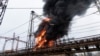 Flames and smoke rise from a blaze at an electricity facility after a Russian attack in Kharkiv, Ukraine, March 22, 2024. Attacks on energy facilities in the Kharkiv region caused blackouts and disrupted critical air-raid siren systems.