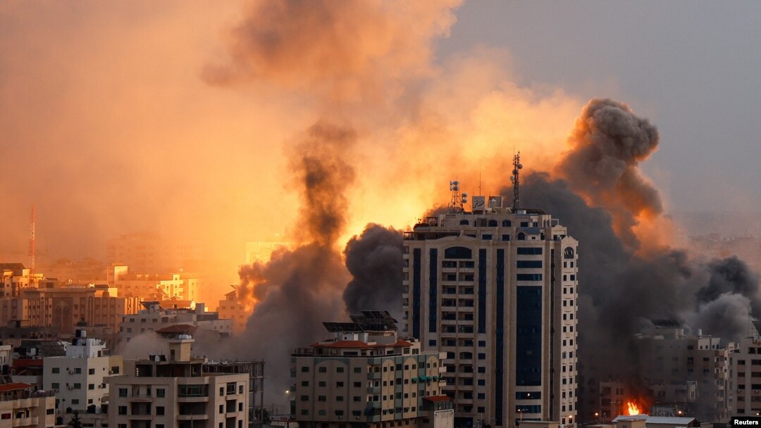 Smoke and flames rise following Israeli strikes in Gaza, Oct. 9, 2023. Israel's chief military spokesperson says Israel had reestablished control of areas near Gaza that Hamas militants stormed in the incursion that began Saturday.