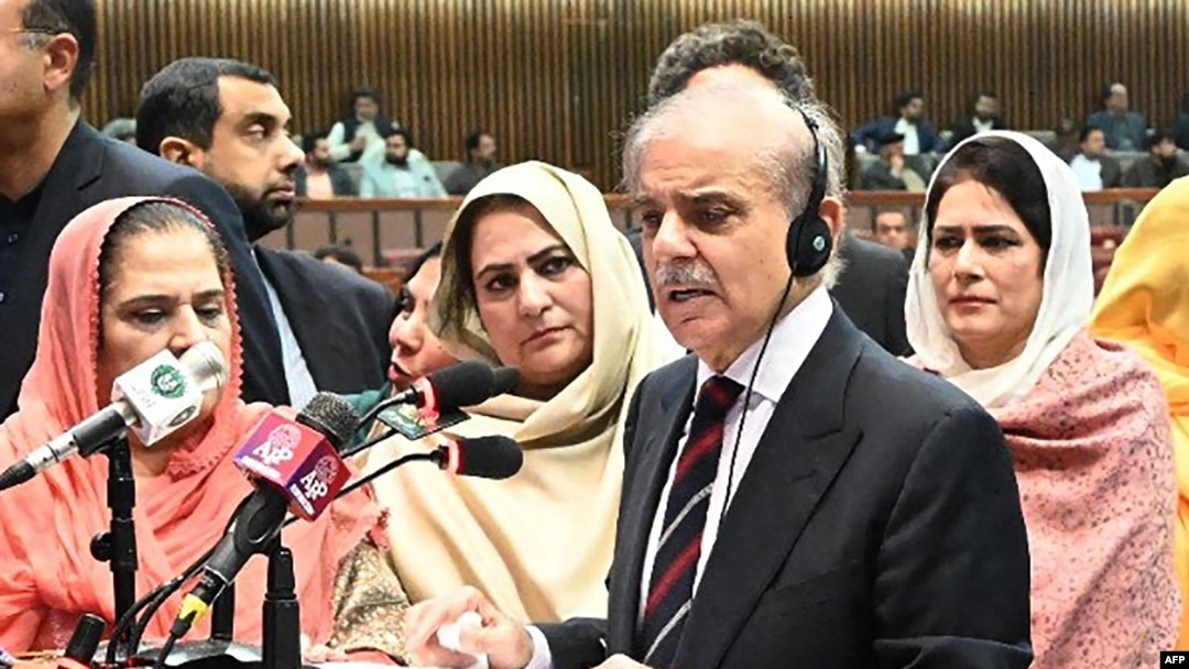 This handout photograph taken and released on March 3, 2024 by the Pakistan National Assembly, shows Pakistan's newly-elected Prime Minister Shehbaz Sharif (2R) addresses the Parliament in Islamabad. (Photo by Pakistan National Assembly / AFP) 