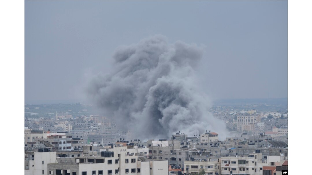 Smoke from an Israeli airstrike rises in Gaza City, Oct. 9, 2023.
