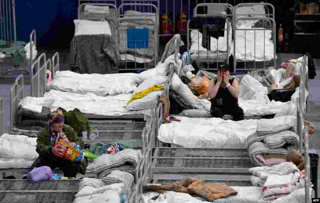 Residents evacuated from the Belgorod region's zones bordering Ukraine, including those from the town of Shebekino, are seen in a temporary shelter set up at the Belgorod Arena in the regional capital of Belgorod.