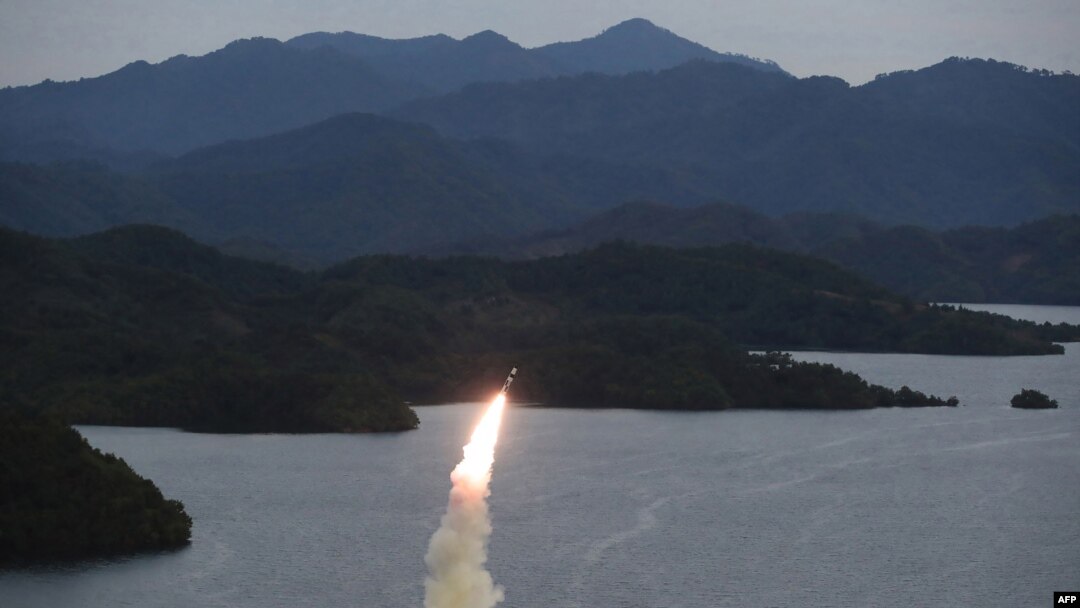 FILE - This undated photo released from the Korean Central News Agency on Oct. 10, 2022, shows a missile launch training by the Korean People's Army Tactical Nuclear Operation Unit from an undisclosed area. On Tuesday, North Korea fired artillery shells into the coastal waters. 