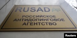 FILE - A sign is on display outside the office of Russian Anti-Doping Agency (RUSADA) in Moscow, March 28, 2018.