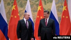 中国国家主席习近平在北京会晤到访的俄罗斯总统普京。（2022年2月4日）