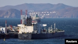 A crude oil tanker is seen anchored at the terminal Kozmino in Nakhodka Bay near the port city of Nakhodka, Russia, Dec. 4, 2022. 