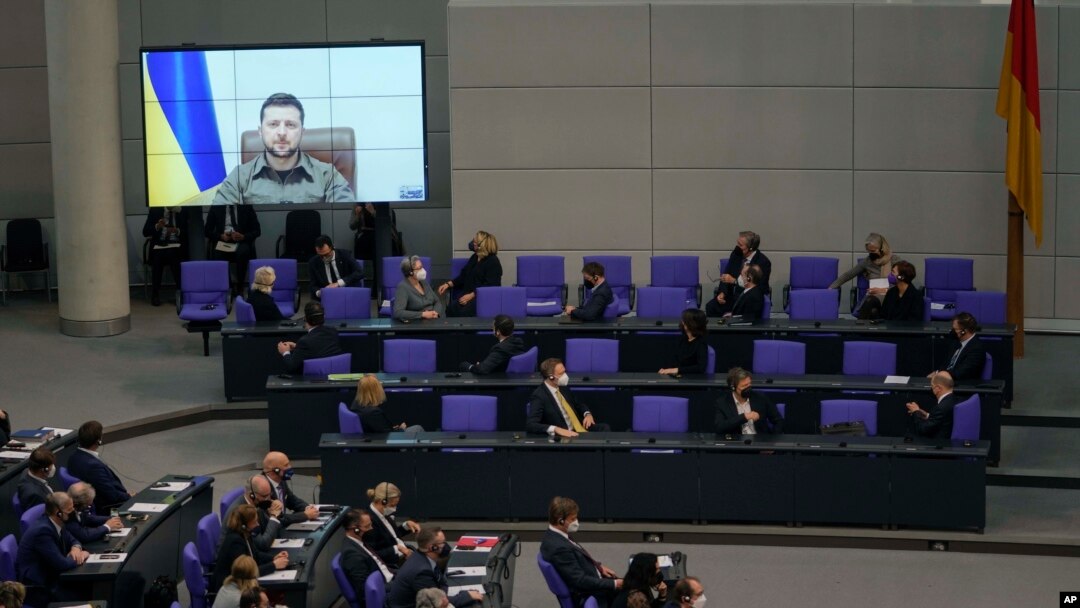 Members of the German Bundestag listen to Ukrainian President Volodymyr Zelenskyy during his virtual address to lawmakers, at the Reichstag Building, in Berlin, March 17, 2022.