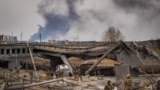 Three men are arrested by the Ukrainian Army after being accused of looting houses in Irpin, Ukraine, March 12, 2022. (Yan Boechat/VOA)
