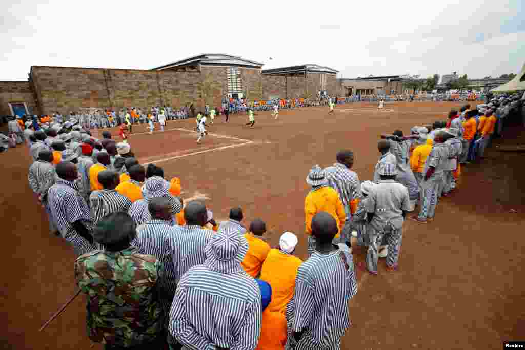 Kenyan prisoners watch a mock World Cup soccer match between Russia and Saudi Arabia, as part of a month-long soccer tournament involving eight prison teams at the Kamiti Maximum Prison, Kenya's largest prison facility, near Nairobi, Kenya, June 14, 2018.