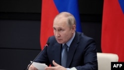 FILE - Russian President Vladimir Putin chairs a meeting with leadership of military-industrial complex enterprises in Tula, Russia, Dec. 23, 2022. (Sputnik/Russian Presidential Press Office/Kremlin via Reuters) 