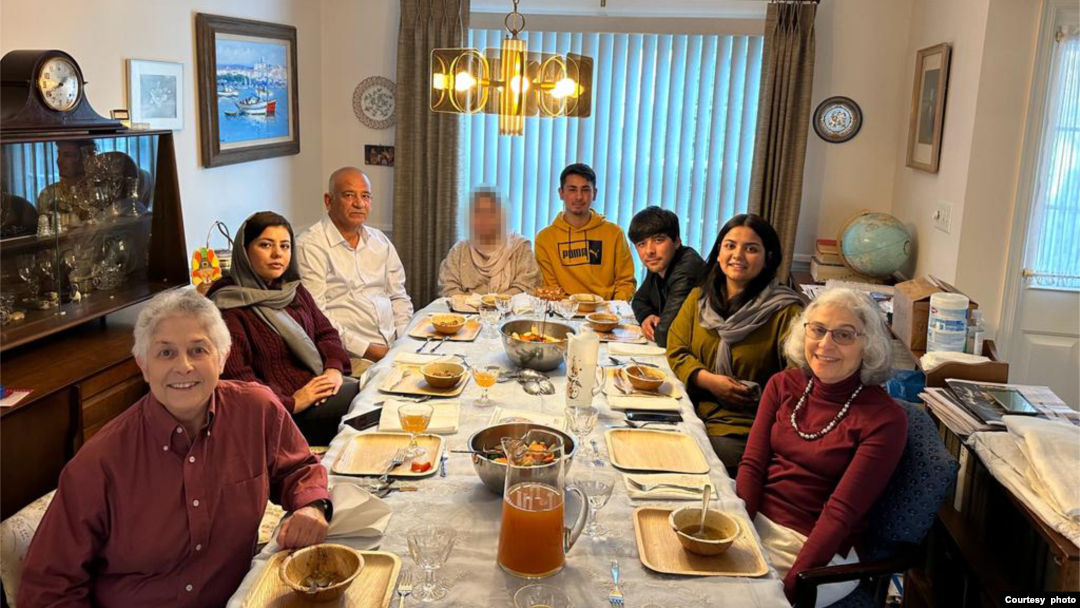 The Pennsylvania family of Judith Samkoff, front right, invited an Afghan refugee family to join them for their first Thanksgiving in the United States. One guest did not want to be identified in the photo. (Photo courtesy of the Jewish Federations of North America)