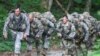 FILE - U.S. Army Ranger candidate soldiers, burdened with heavy packs and weapons, conduct Mountaineering training during the Ranger Course on Mount Yonah in Cleveland, Georgia, July 14, 2015.