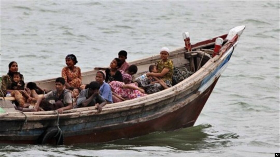 Burmese Rohingya Muslims fleeing religious violence are intercepted by Bangladesh border authorities, Taknaf, Bangladesh, June 13, 2012.