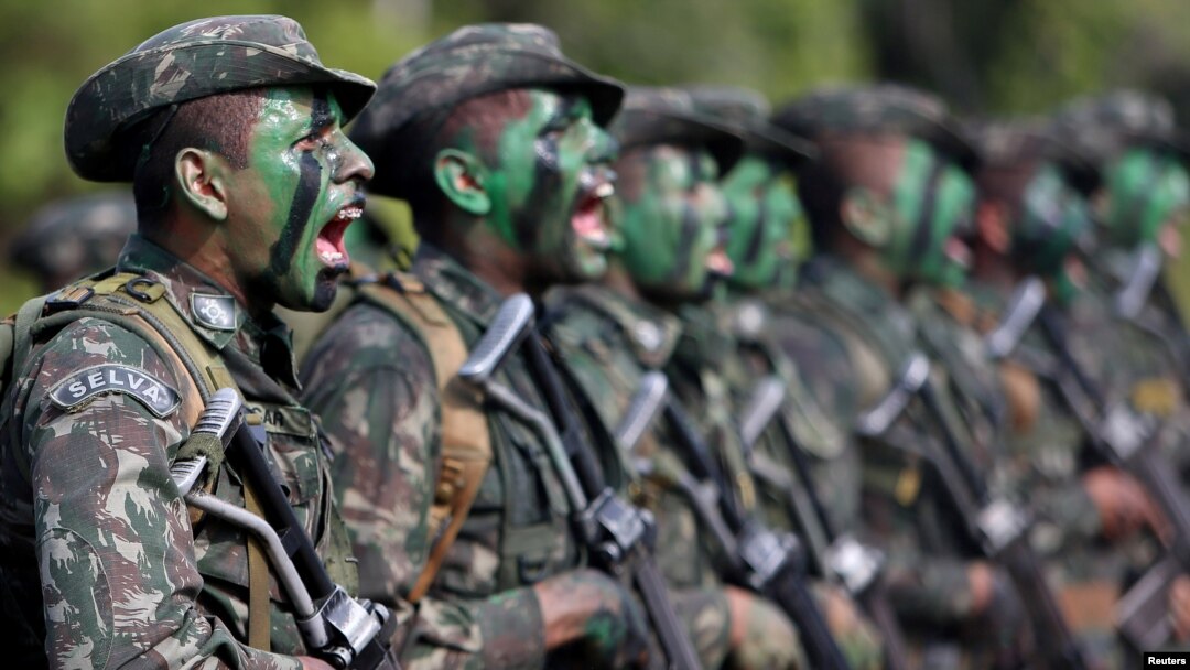 Brazilian Army soldiers react at the border with Colombia during a training to show efforts to step up security along borders, in Vila Bittencourt, Amazon State, Brazil, Jan. 18, 2017. 