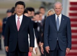 资料照：中国国家主席习近平与时任美国副总统拜登