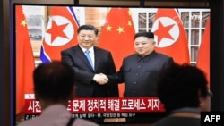 韩国一车站播报习近平与金正恩会晤的新闻