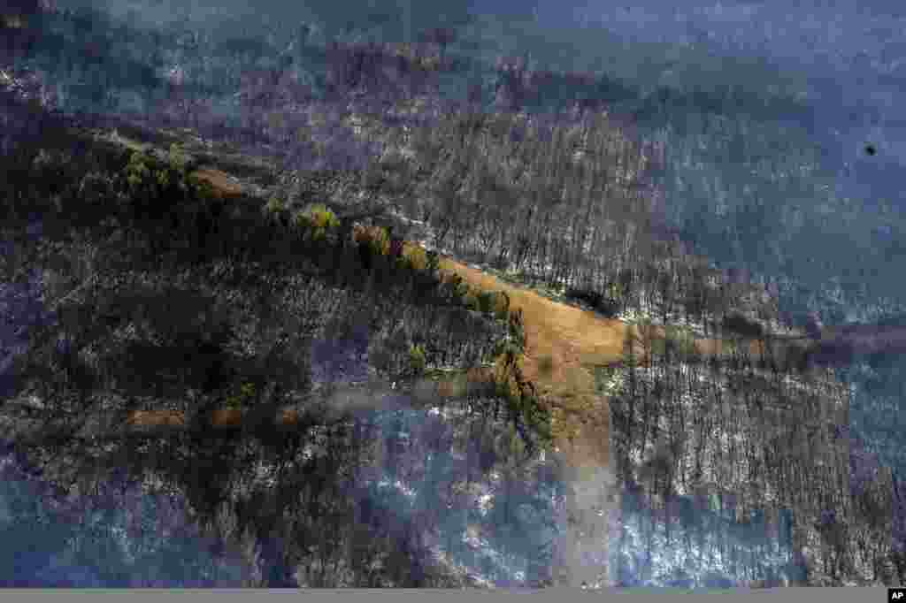 A photo taken from a helicopter shows a burning forest near the tourist resort of Marmaris, Mugla, Turkey, Aug. 3, 2021.