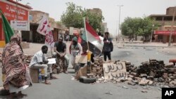 People stage a sit-in demanding a return to civilian rule and to protest the killing nine people in anti-military demonstrations last month, in Khartoum, Sudan, July 4, 2022.