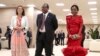 King Mswati III, of Swaziland and his wife, right, arrive to attend a welcome ceremony of the Russia-Africa summit in the Black Sea resort of Sochi, Russia, Oct. 23, 2019.