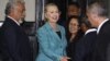 U.S. Secretary of State Hillary Clinton (C) shakes hands with staff members next to East Timor's Prime Minister Xanana Gusmao (L) at the Prime Minister's office in Dili September 6, 2012. 