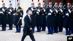 FILE - Ukrainian President Volodymyr Zelenskiy arrives to the Elysee Palace, Monday, Dec. 9, 2019 in Paris. The leaders of Russia, Ukraine, Germany and France meet to try to seek a settlement for the five-year conflict in eastern Ukraine.