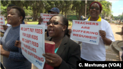 Teachers demanding to be paid in U.S. dollars take to the streets in Harare, Zimbabwe, Nov. 9, 2018. 