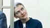 Nadiya Savchenko sits in a glass cage during proceedings against her in a court in Donetsk, in Russia's Rostov-on-Don region, March 21, 2016. 
