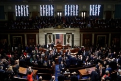FILE - House members vote on article II of impeachment against President Donald Trump, on Capitol Hill in Washington, Dec. 18, 2019.