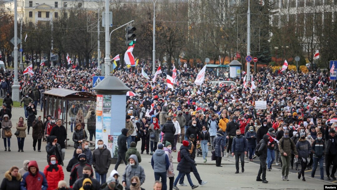 Belarusian opposition supporters walk during a rally to reject the presidential election results in Minsk, Belarus, Nov. 1, 2020. 