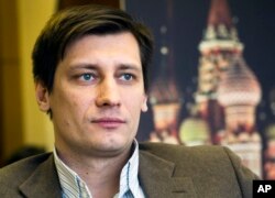 FILE - Dmitry Gudkov poses in the State Duma, Russian parliament lower chamber, in Moscow, Russia, Feb. 10, 2016.