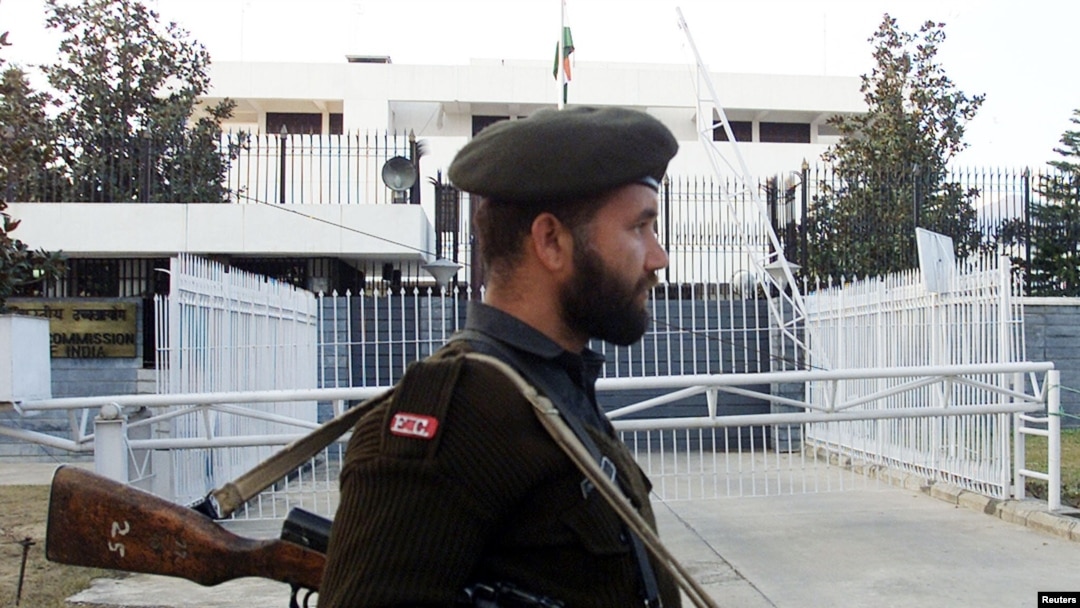 FILE - A Pakistani soldier stands guard in front of the Indian High Commission in Islamabad, Feb. 8, 2003. 