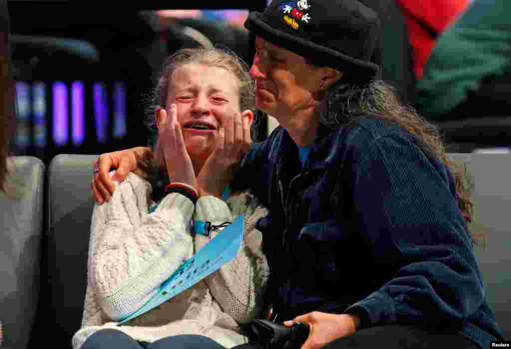Anita Beroza of Belmont, CA, is comforted after she was eliminated from the Scripps National Spelling Bee at National Harbor in Maryland, May 30, 2018.