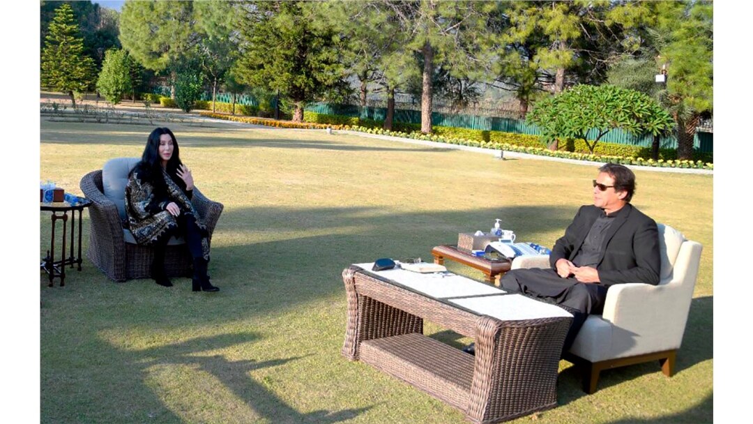 In this photo provided by Pakistan's Press Information Department, Cher, left, talks to Pakistan Prime Minister Imran Khan during their meeting in Islamabad, Nov. 27, 2020.