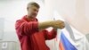 FILE - Opposition mayoral candidate Yevgeny Roizman casts his ballot at a polling station during a mayoral election in the Urals city of Yekaterinburg, Sept. 8, 2013.