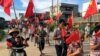 Villagers carrying Chinese national flags protest at Wukan village in China's Guangdong province, June 20, 2016. 