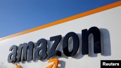 FILE - The Amazon logo is seen at the company logistics center in Boves, France, Aug. 8, 2018.