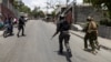 Haitian prime minister travels to US as Kenyan police patrol capital