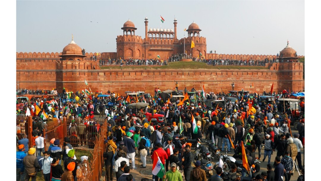 Farmers gather in front of the historic Red Fort during a protest against farm laws introduced by the government, in Delhi, India, Jan. 26, 2021.