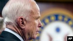 FILE - Sen. John McCain, R-Arizona, speaks to reporters, on Capitol Hill in Washington, July 27, 2017.