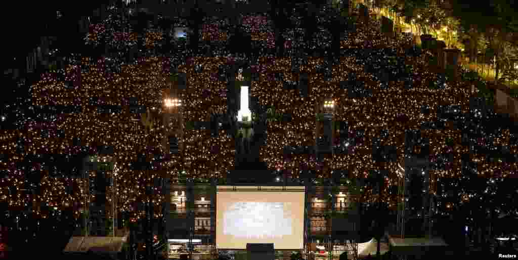 Thousands of people take part in a candlelight vigil to mark the 29th anniversary of the crackdown of pro-democracy movement at Beijing's Tiananmen Square in 1989, at Victoria Park in Hong Kong, China.