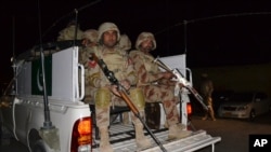 FILE - Pakistani troops are seen on a pick-up truck in Quetta, Baluchistan province, Pakistan, Oct. 25, 2016.