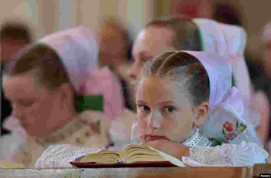Catholic Sorbs, wearing traditional costumes, take part in the annual Corpus Christi mass in Crostwitz, Germany.