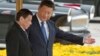 FILE - Chinese President Xi Jinping, right, shows the way to Philippine President Rodrigo Duterte during a welcome ceremony outside the Great Hall of the People in Beijing, China, Oct. 20, 2016.