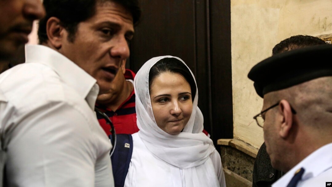 Aya Hijazi, center, a dual U.S.-Egyptian citizen, is acquitted by an Egyptian court after nearly three years of detention over accusations related to running a foundation dedicated to helping street children, Cairo, April 16, 2017. 