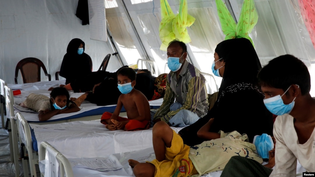 FILE - Rohingya refugees, who suffer from diphtheria, are treated at a Medecins Sans Frontieres (MSF) clinic near Cox's Bazar, Bangladesh, Dec. 18, 2017.