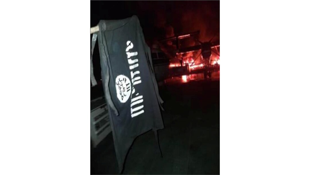 FILE - An image distributed by al-Shabab after the attack on a military base in Kenya shows the militant group's flag at Manda Bay Airfield in Manda, Lamu, Kenya, Jan. 5, 2020.